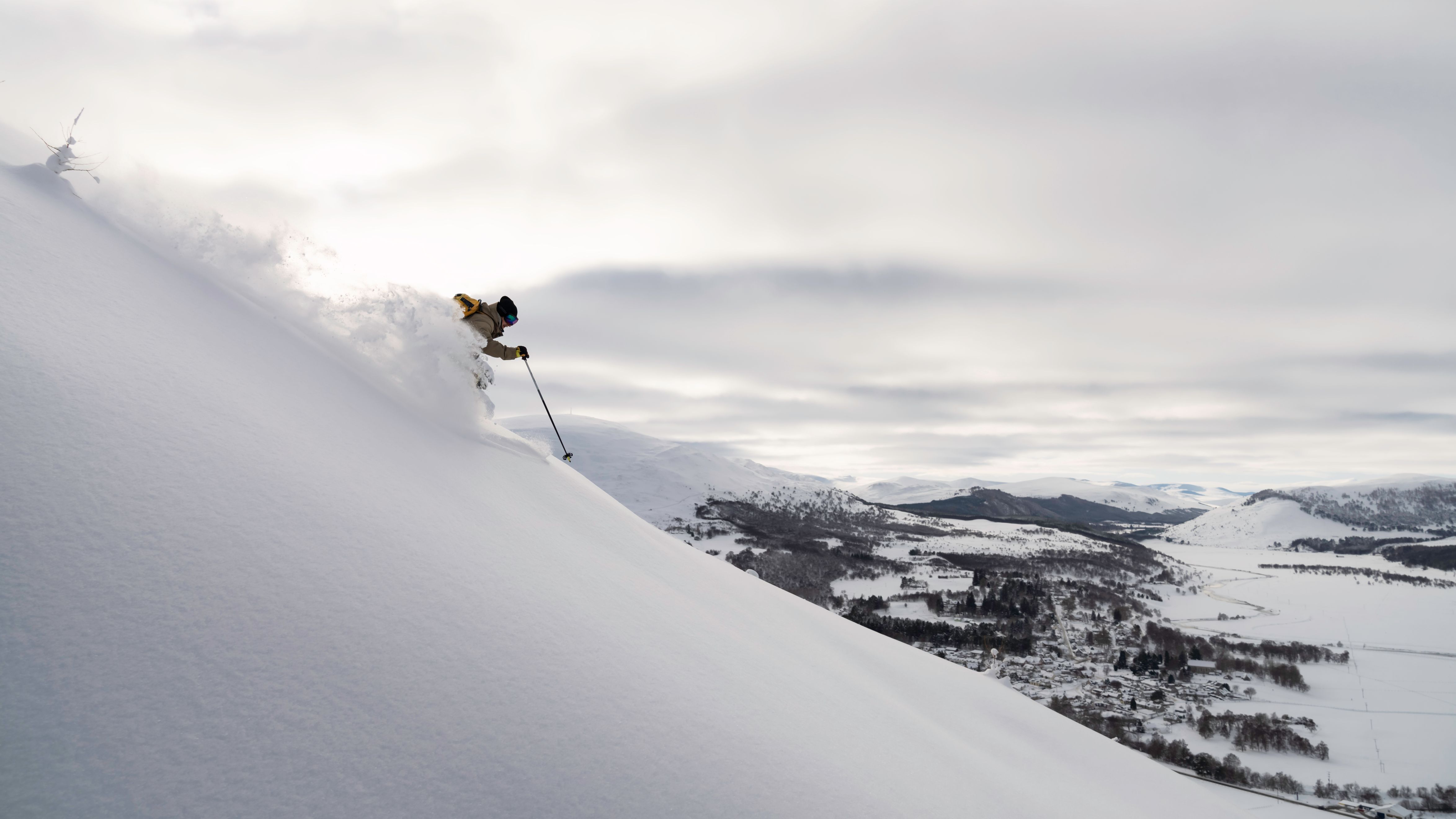 Skier riding down run