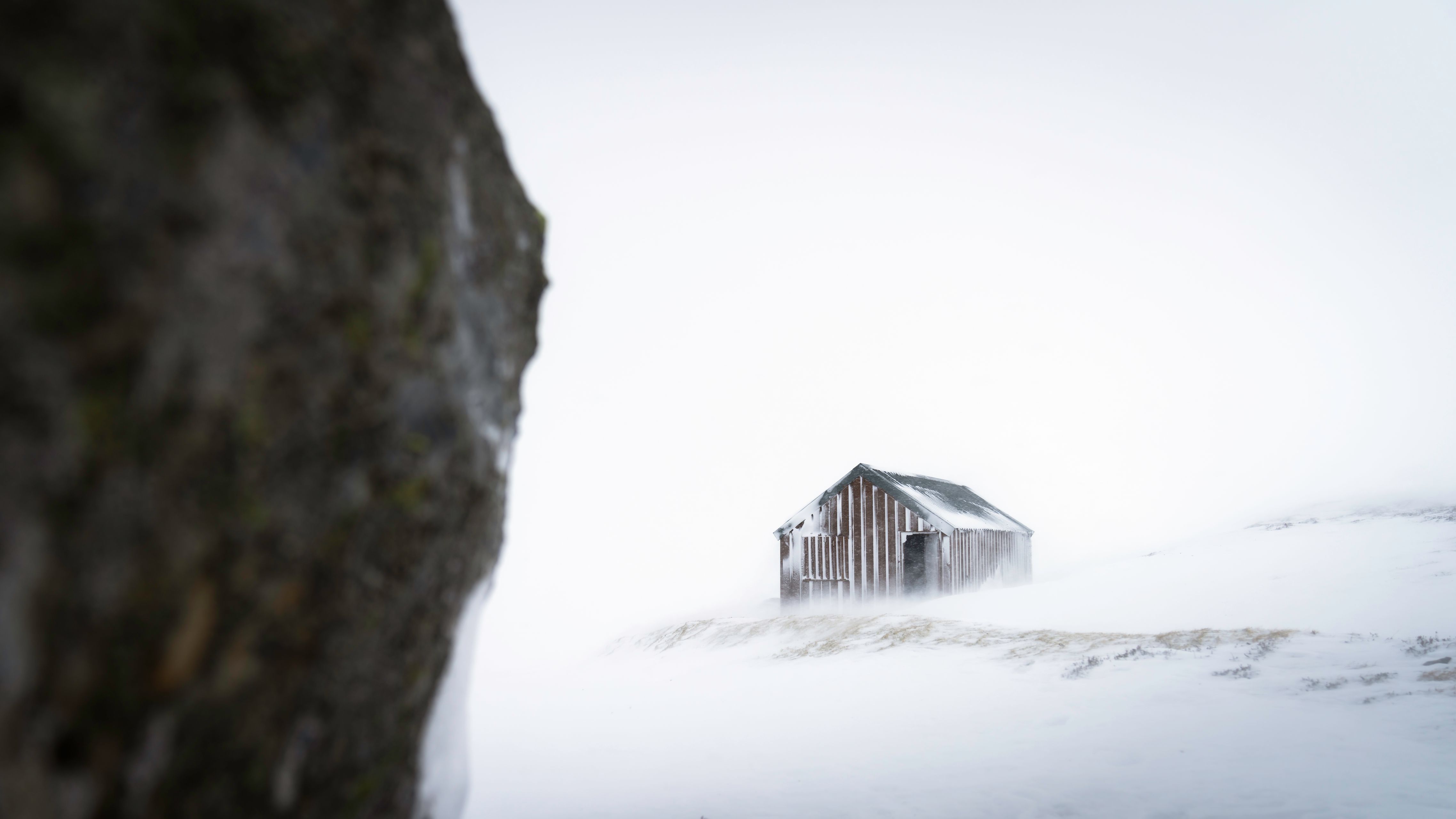 Small cabin in snowstorm