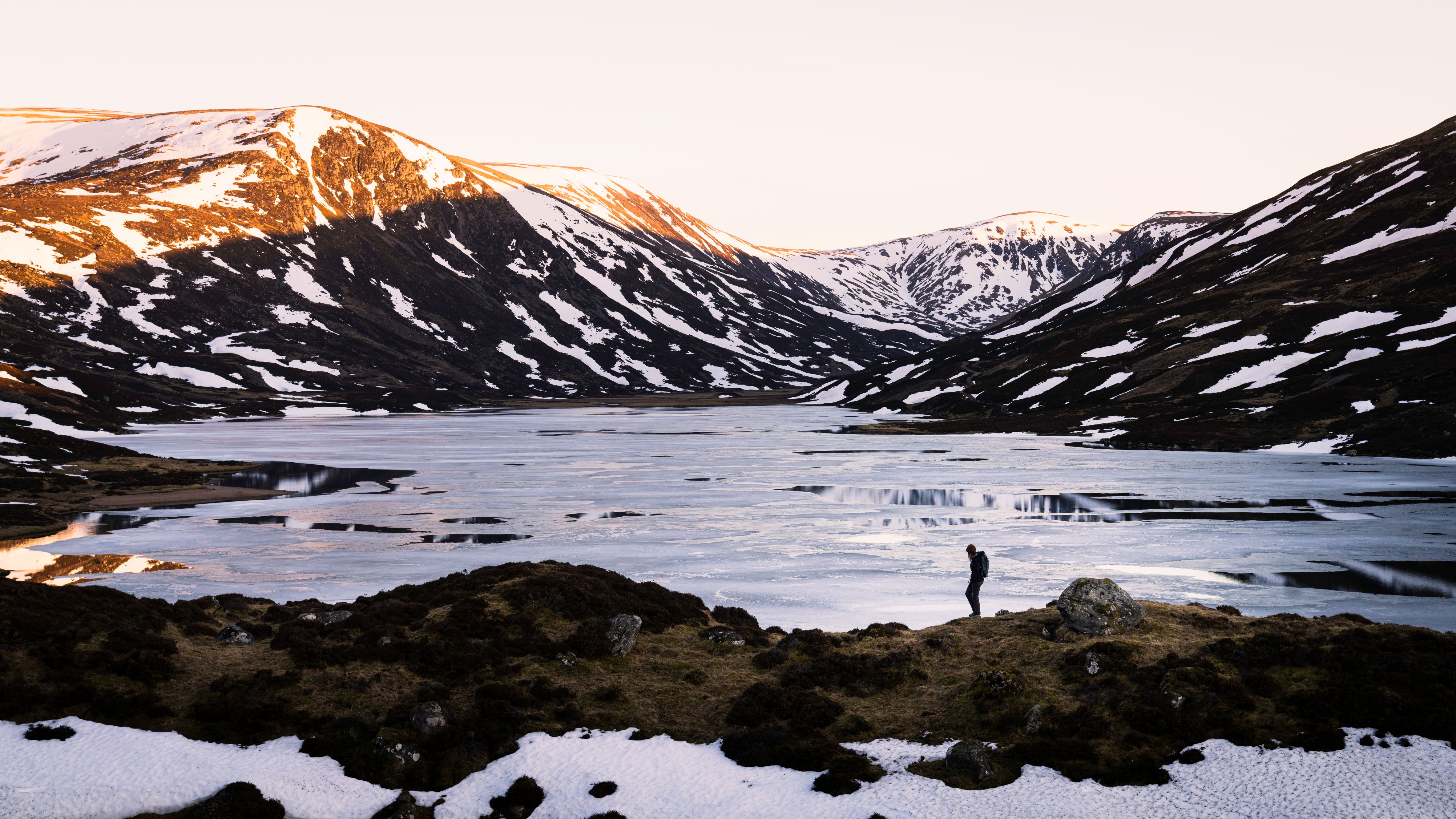 Figure walking across frozen lake