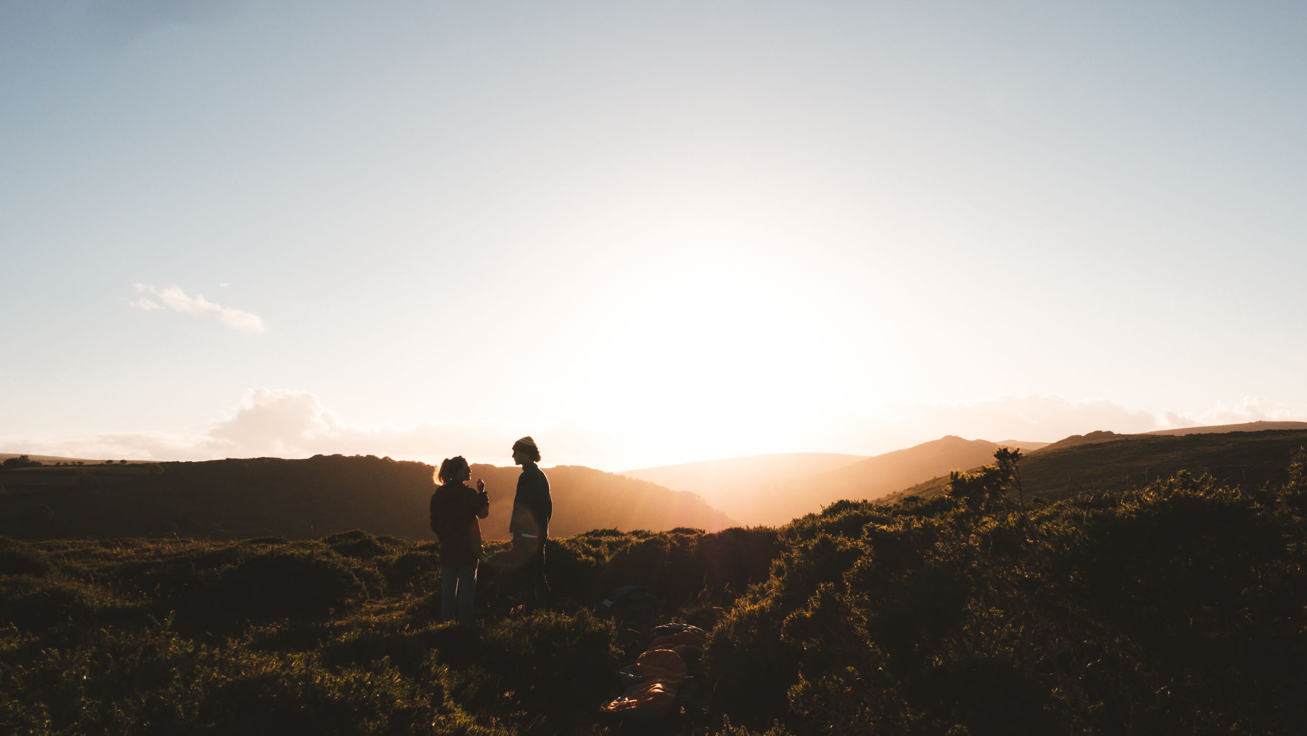 Two people talking in english field