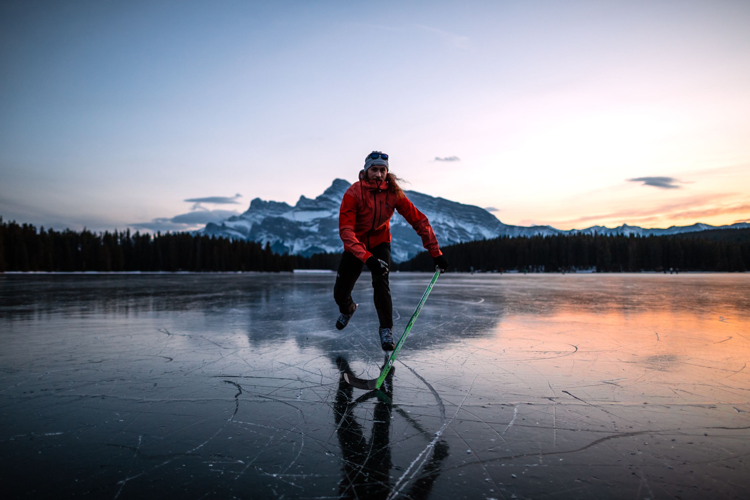 Ice skater on frozen Canadian lake. 