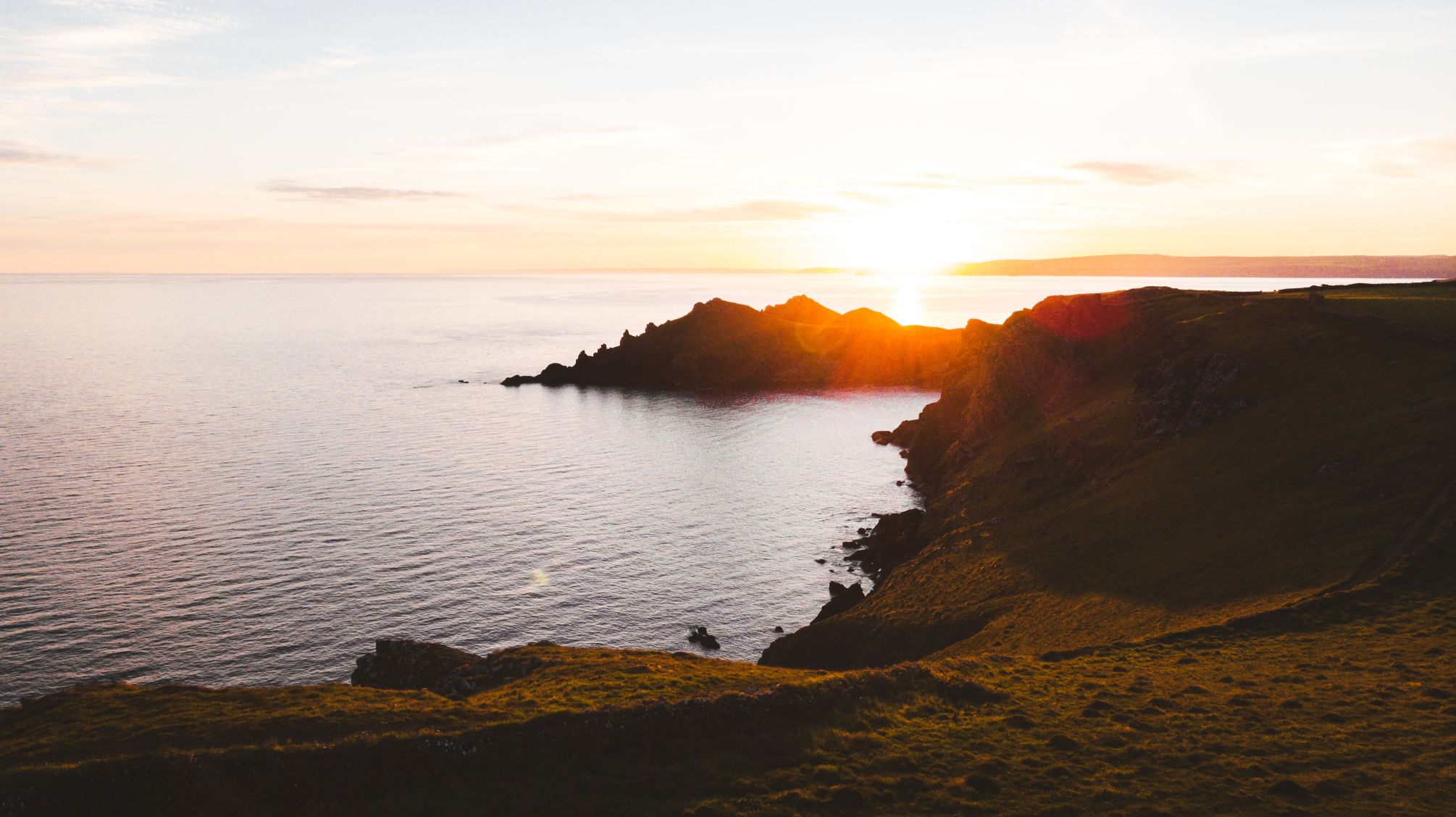 Sunset of ocean and hillside