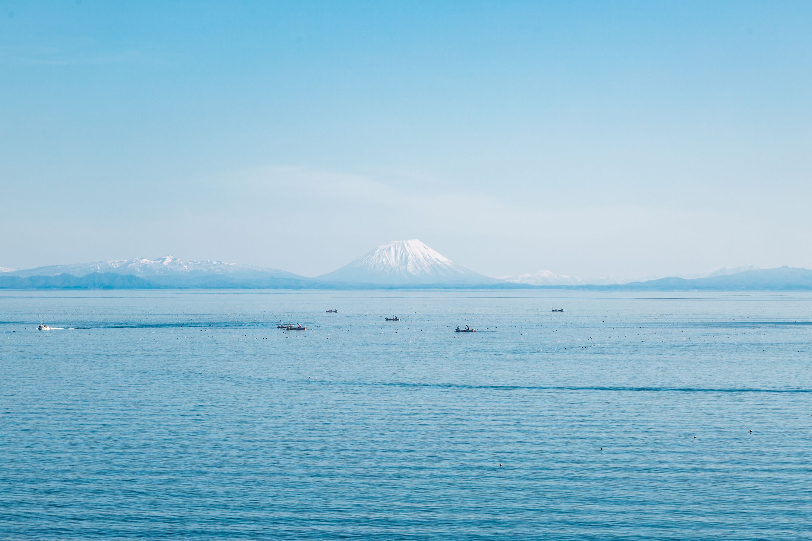 Looking across the sea to a mountain in the distance. 