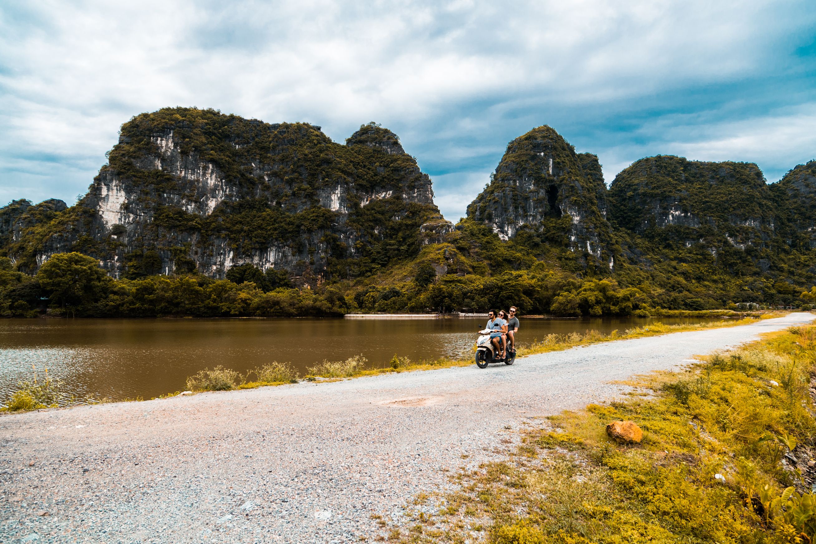 Three friends riding a scooter in Northern Vietnam 